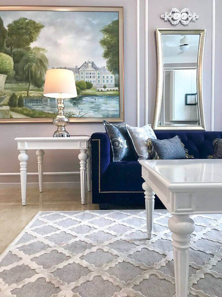 Purple Earl sofa in a Victorian-inspired home, styled with white coffee tables and classic detailing.