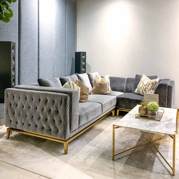 The stylish dark velvet Fitzgerald Sofa (Custom L-shaped) provides comfortable, affordable luxury in the modern living room of the Victoria Park Villas in Singapore.