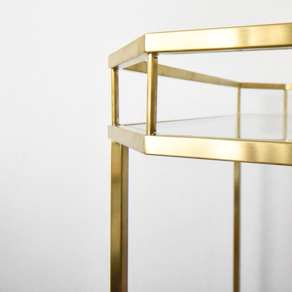 Close up look of the brushed gold effect on stainless steel finishing, creating a matte yet luxurious look on the bar cart.