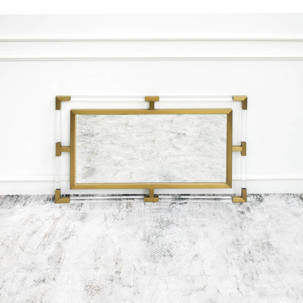 Acrylic Gold Wall Mirror sits on luxury rug and is perfect for white and gold themed living room, bedroom or bathroom Mirror.