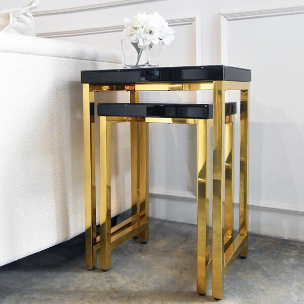 Nesting side tables in black and gold, small and petite collection, tucked in.