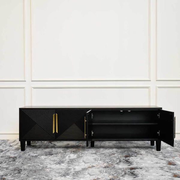 One door opened to show the storage space on one side of the Uno 4 door console with one piece horizontal shelf in centre. 