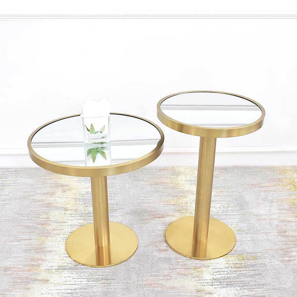 Vis-a-vis Brushed Gold Coffee Table and Side Table Collection pair up with Vera Gold Rug for a timeless luxury look in a modern living room. The collection comes in two sizes for a timeless staggered design, as displayed at Finn Avenue Online Furniture Showroom. 