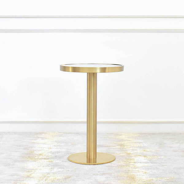 Vis-a-vis Round Gold Petite Side Table, a space saving end table that sits on a pedestal round gold base for a small yet modern living room. Small round mirrored table top is inset gold rim gives a timeless classy appeal.