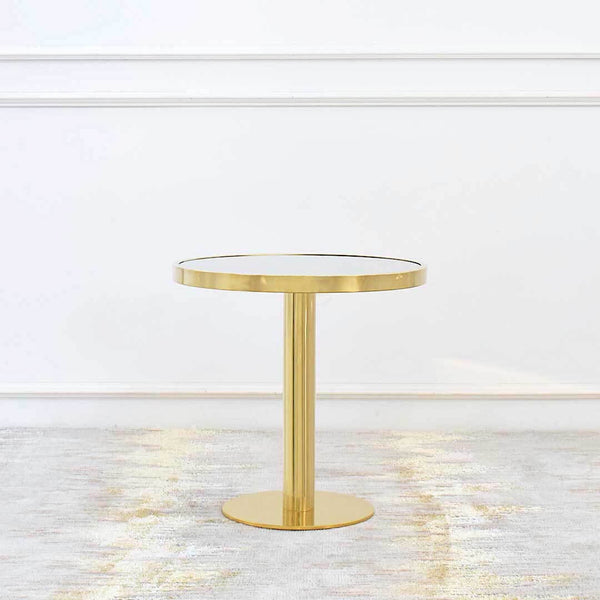 Vis-a-vis Polished Gold Coffee Table (grande) sits on a pedestal round gold base for a luxurious yet timeless feel. Round mirrored table top is inset polished gold rim in stainless steel.