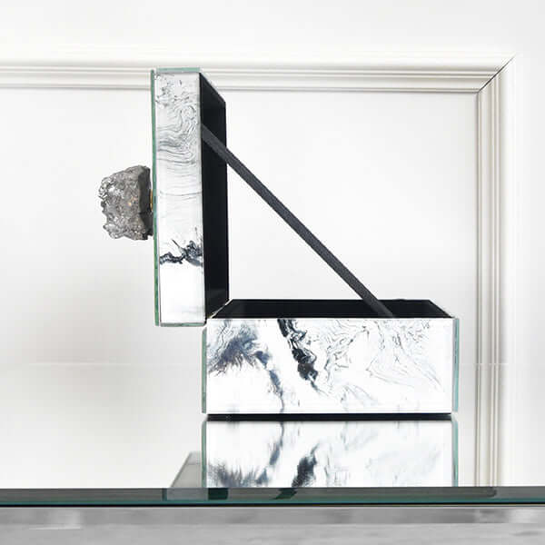 Opened side view of the Zeus white swirl marbled box.