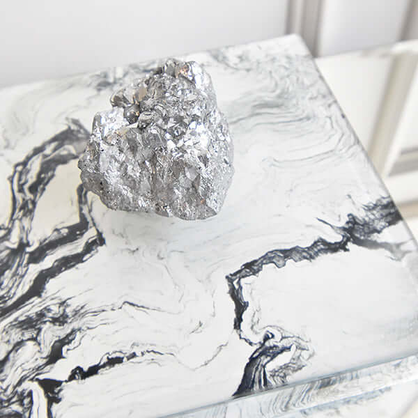 Close up view of the crystal handle of the White Marbled Box for Home Design.