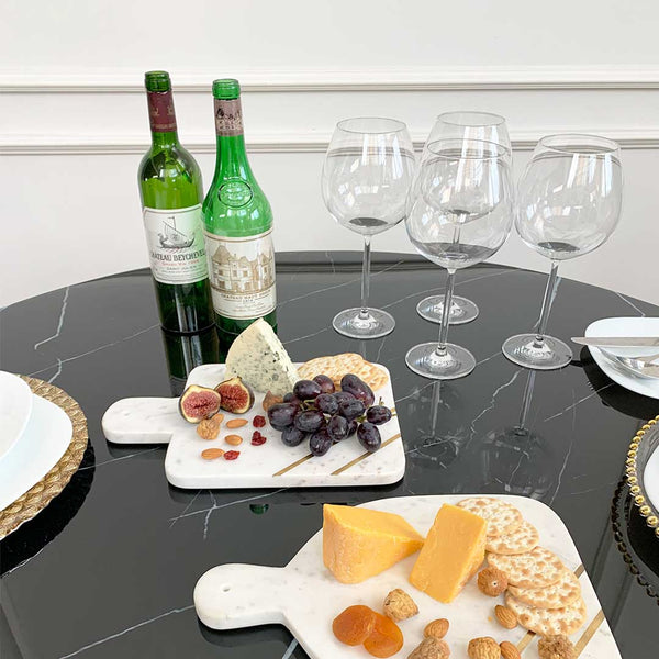 Buffet details on Emma black round dining table with Park Avenue Marble trays.