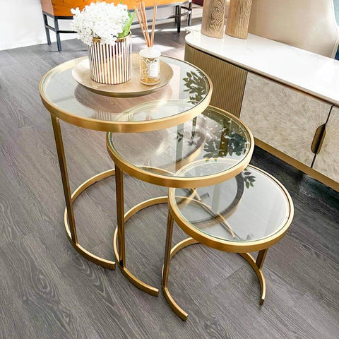 Wallich Glass Nesting table design, allows flexibility to stow within, or pull up for an extra table. Maximise your living room space with a glass nesting table.