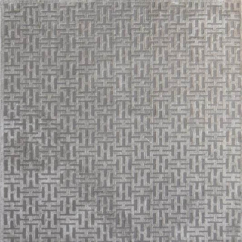 Wolfgang Geometric rug, in varying hues of light and dark grey. This rug brings warmth and comfort to any living space.