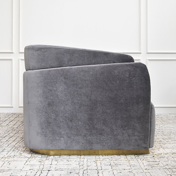 Side view of the Zelda sofa, silhouette of the curved back to armrest transitions smoothly interconnecting.