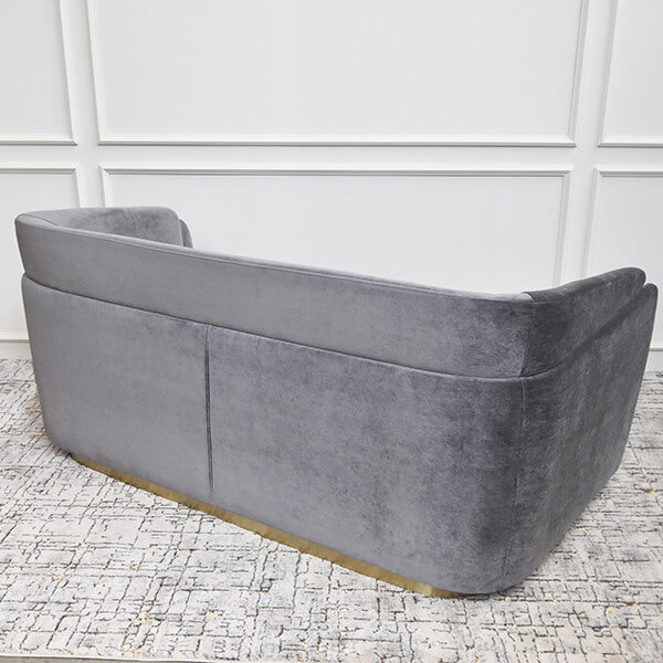 Back view of the Zelda sofa, features a inviting silhouette with smooth velvet upholstery choices that recalls the Old Hollywood glamour.