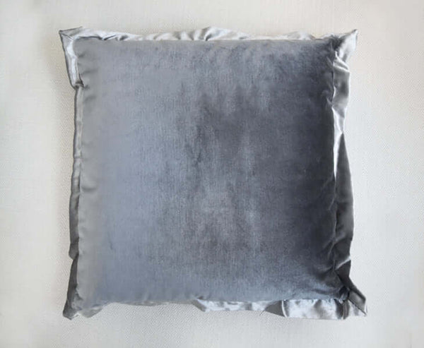 Smooth velvet with high shine and multi hued, Flanged details at cushion ends.