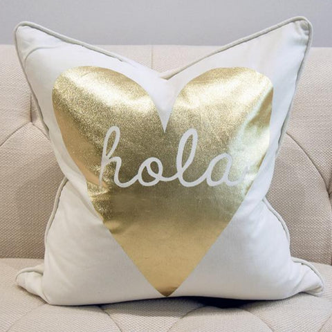 Ivory Throw Pillow with gold heart shape and hola text.