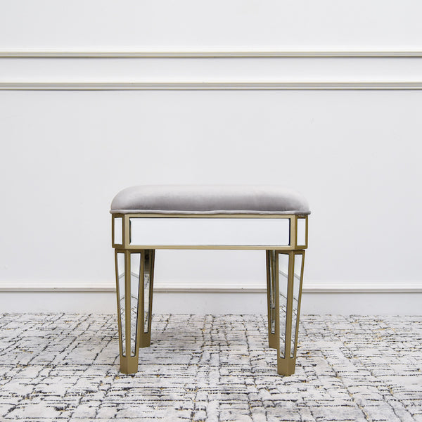 Close up look of Alchemy stool in lush grey velvet and mirrored leg details.