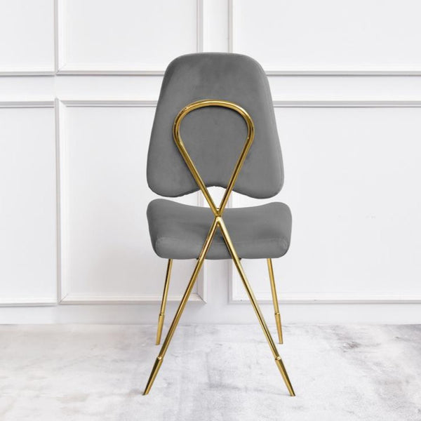 Shiny and polished Gold against creamy Grey Velvet Dining Chair with Gold Cross Design at the back for a modern twist.