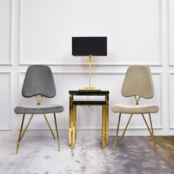 A gorgeous hand-crafted accent chair that works beautifully as a dining chair, living room accent chair or a dressing chair at the vanity. Available in Grey Velvet and Champagne Velvet.