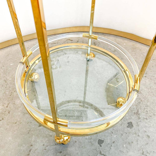 Bottom look of the glass shelves, acrylic handles surrounding shelves. 