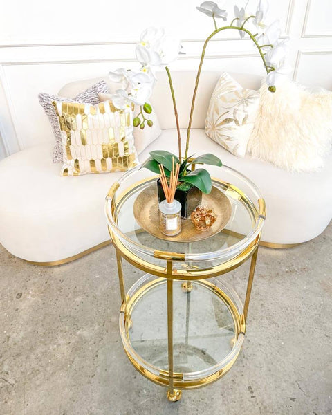 Top view of the acrylic and gold bar cart round trolley, Atelier.