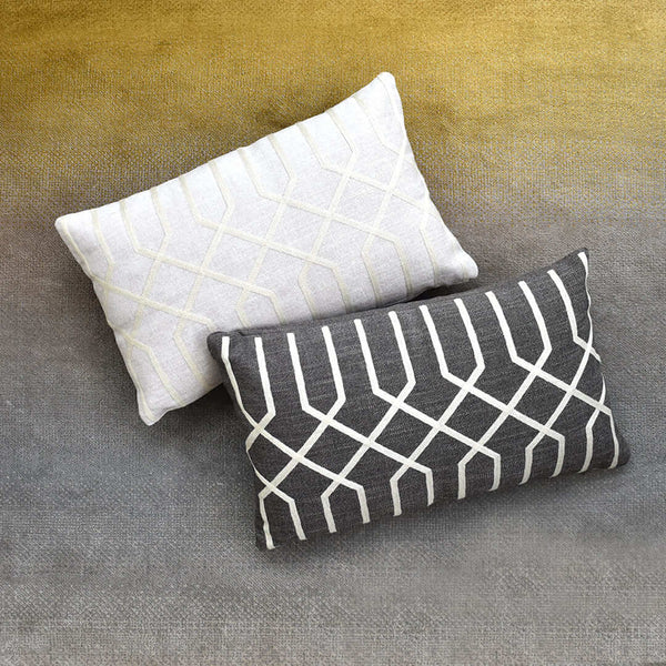 Atticus rectangular cushions on top of Evka Moon Rug. 