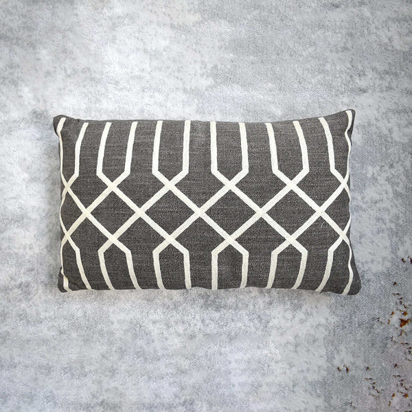 Atticus Brown Boudoir Cushion in Linen, with Ivory embroidery threads.