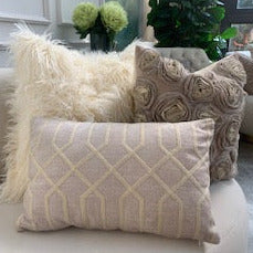 Fur fur Ivory cushion with Atticus Beige Boudoir cushion and Finley floral cushion.