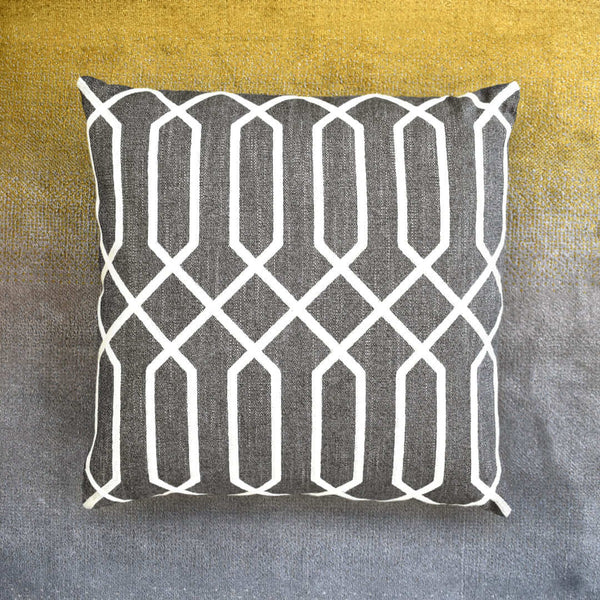 Portrait view of Atticus square linen cushion in Brown with Ivory embroidery patterns.