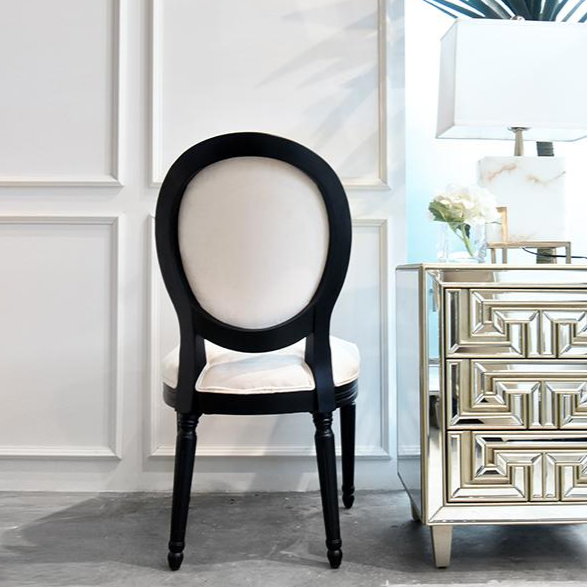 Back view of the Auguste King Louis Chair, Bold black solid wood frame with off-white velvet upholstery.