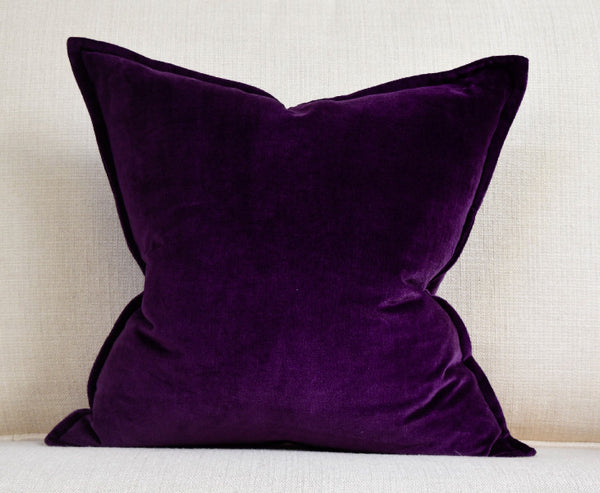 Fluffed up dark purple pillow cushion.