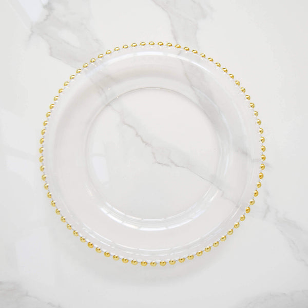 A perfect charger plate for your home dining table set-up, this Barbican clear glass charger with gold scalloped beads makes a perfect gift for for weddings and housewarming for your family and friends.