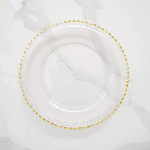 A perfect charger plate for your home dining table set-up, this Barbican clear glass charger with gold scalloped beads makes a perfect gift for for weddings and housewarming for your family and friends.