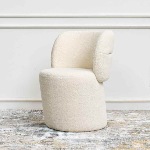 Side view of bonbon accent chair in ivory in popular boucle 'looped fiber' fabric.