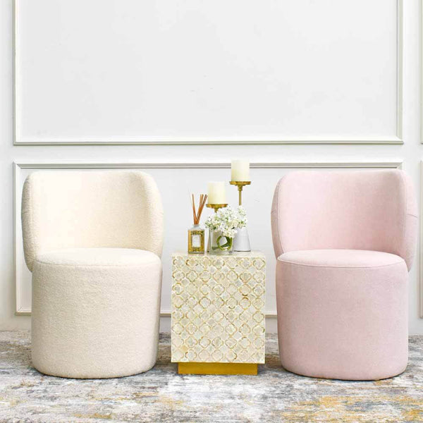Decorated with Capiz end Table, this Bonbon accent chair set features soft fluffy boucle upholstery that showcases fun and liveliness of a bright airy spacious home. Available in blush pink and ivory cream at Finn Avenue Home Furniture Store.