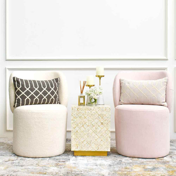 Style the Bonbon accent chairs with a petite side table and  boudoir cushion on the seats.