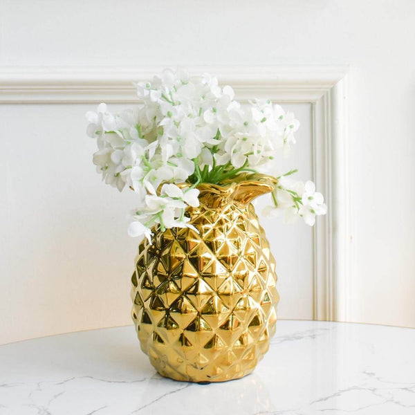Chanceux ceramic gold jar, with pineapple details and texturing. Versatile decor piece, usable as a a vase or as a jar.