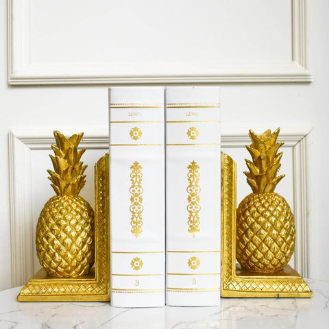 Gold pineapple bookends are a versatile decor piece. Textured and in gold for a pop of colour.