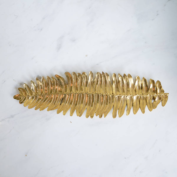 Add a natural element to your home with the Gold Fern Leaf Sculpture tray. 