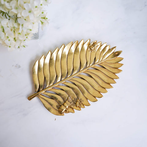 Monstera Leaf Gold Tray with bugs on sculptured tray design.