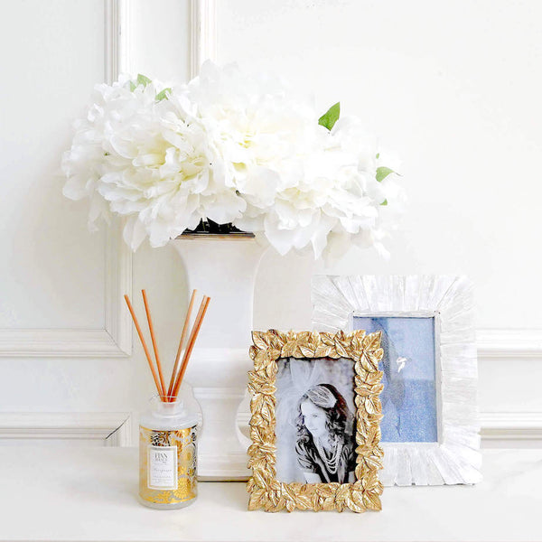 Style your home with diffusers as a filler in between large objects like vases and picture frames.