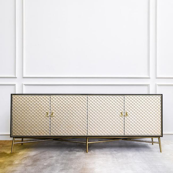 Elize 4 Door Credenza in light champagne mixed hues on the mermaid scale-like doors and stainless steel cross legs.