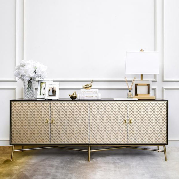 Artisanally crafted in brilliant walnut, this Elize 4 Door TV Console Cabinet, a hand-crafted accent TV & Media Console is enriched with hand works detailing distressed style hand-brushed strokes effects in champagne-gold mixed hues for a vivid vintage appearance.