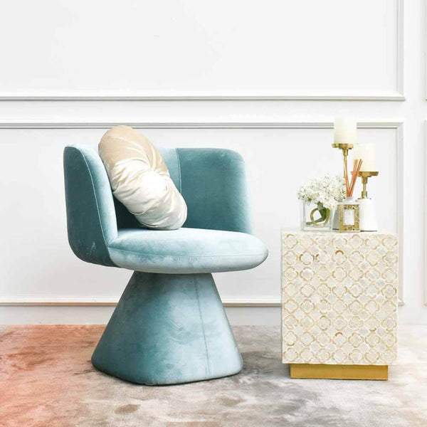 Add an Opal Round Cushion for an added glam and contrast on your Escargot Mint armchair.