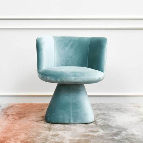 Mint smooth velvet swivel armchair.