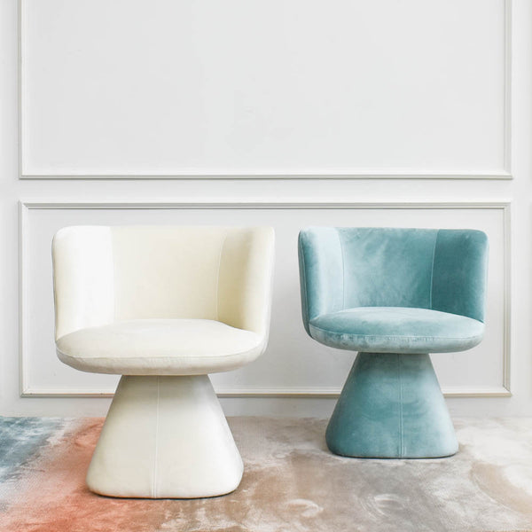 Lustrous polyester velvet swivel vanity chair. Available in Ivory and mint.