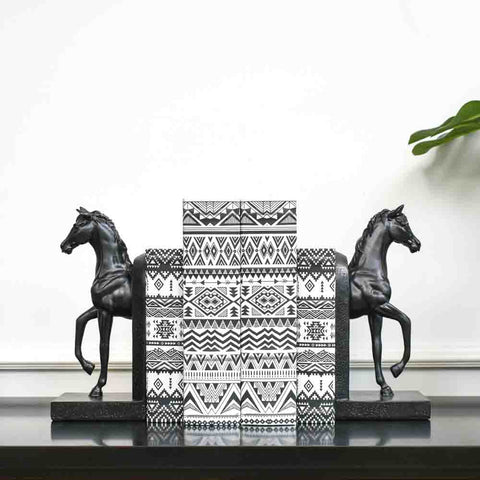 Faer Stallion Black Horse Bookends, a timeless decor piece, displayed with the Latitude Motifs Book Box in between.