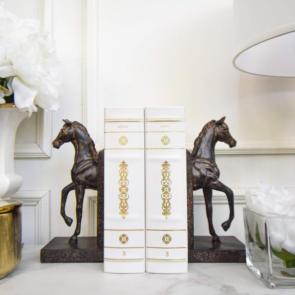 Sandwiched in between the classy Faer Stallion Bookends, create a subtle contrast with the White Faux Leather book boxes.