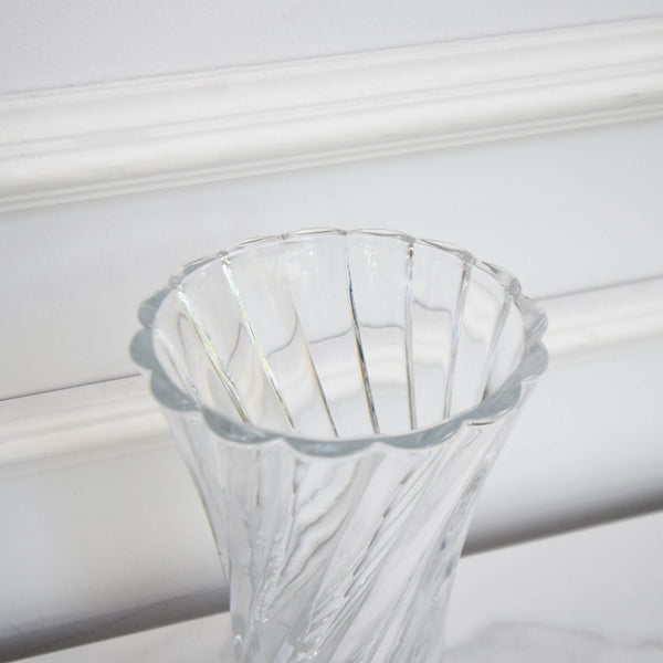 Zoom in details of Fontaine hourglass vase with swirling details.