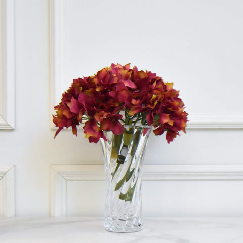 Small hourglass vase for a vintage feminine flair, add some hydrangeas for a fresh look.