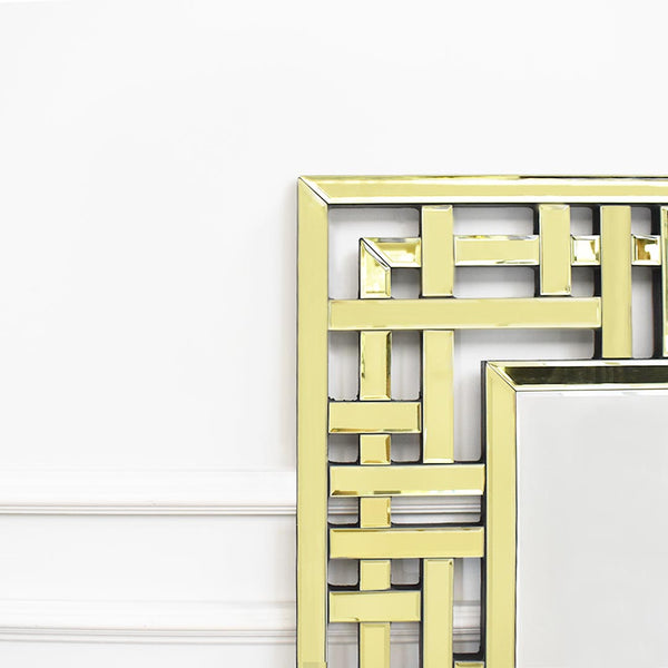 Zoomed in details of Desiree Wall mirror with gold geometric details. 