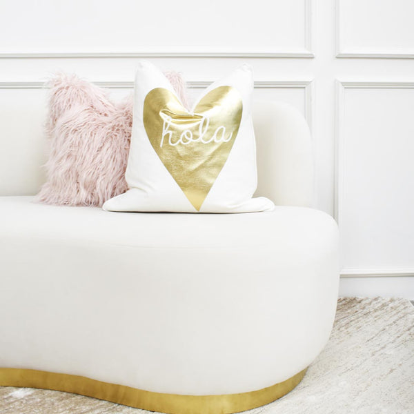 Hola pillow with furfur baby pink pillow on infiniti sofa.